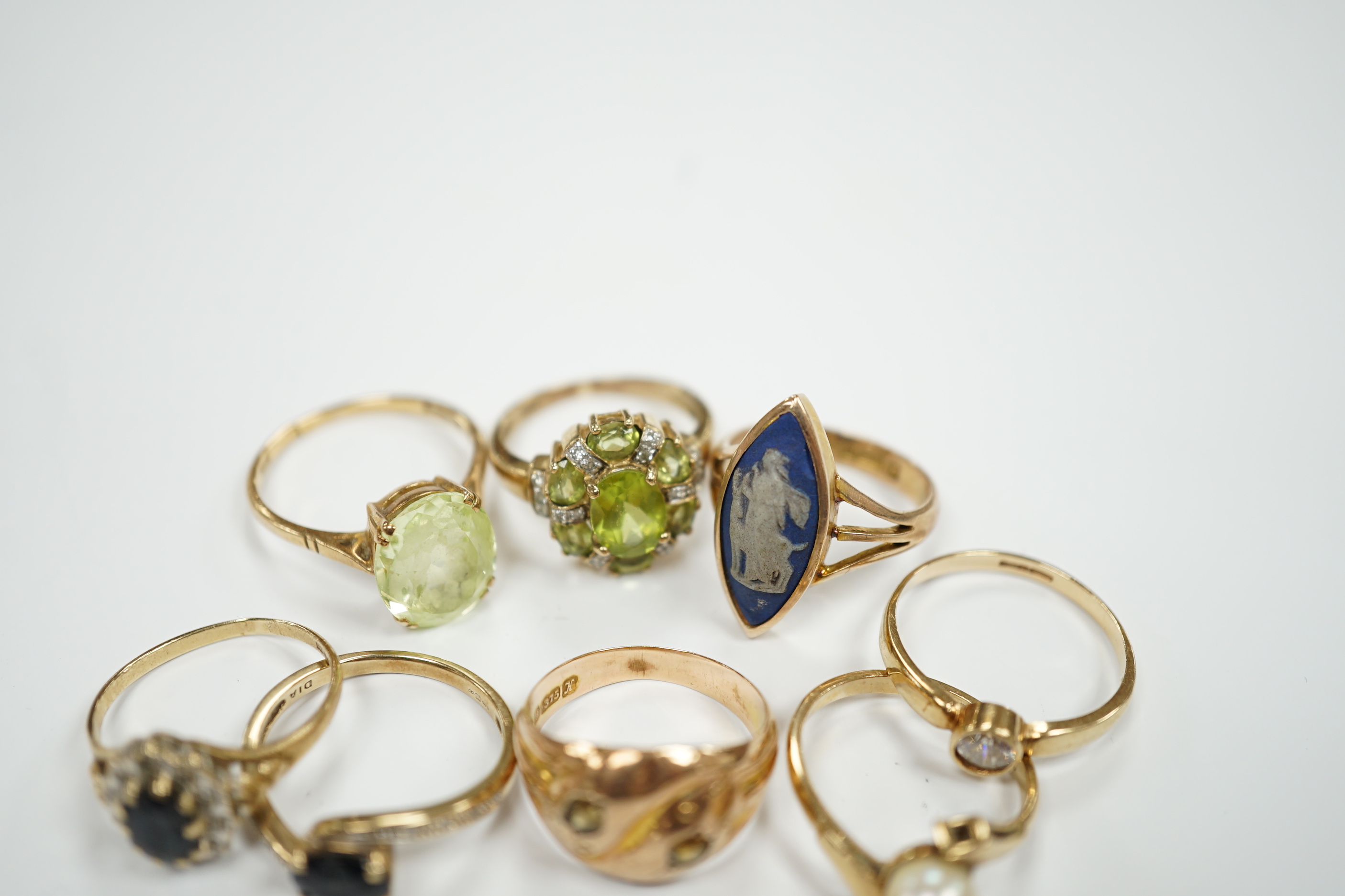 Eight assorted modern 9ct and gem set dress rings, including Wedgwood plaque set, gross weight 19.9 grams.